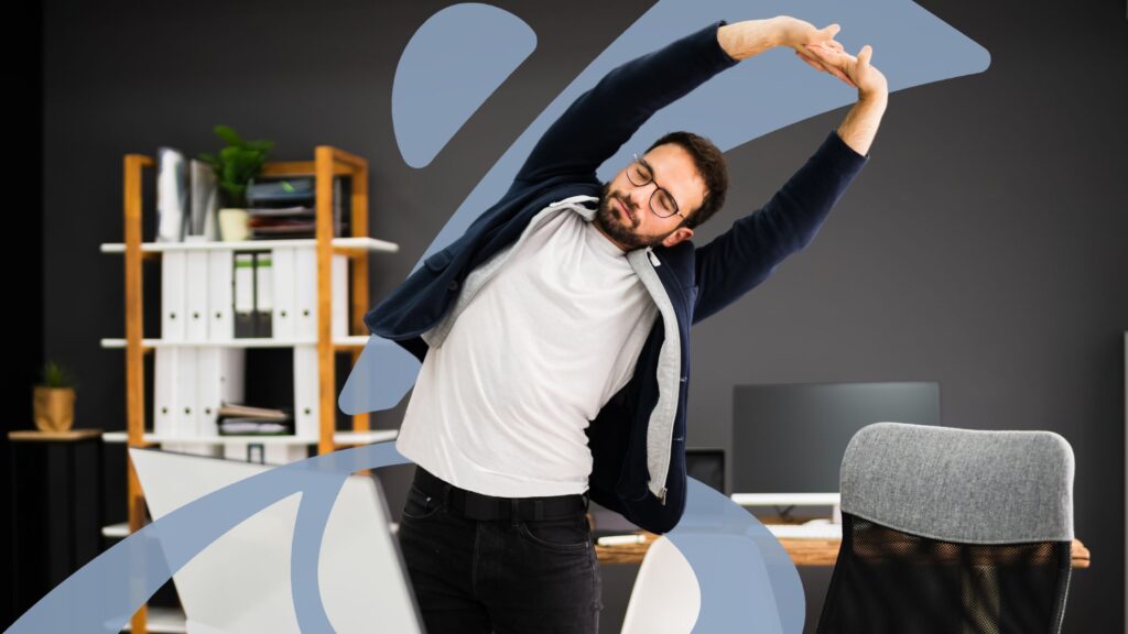 man standing in office doing desk stretches