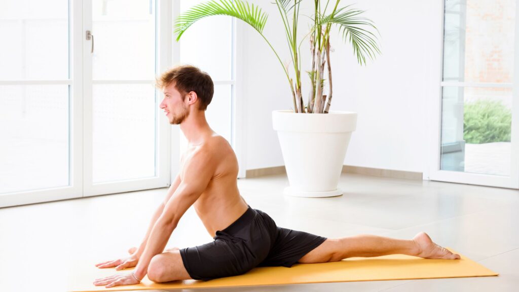 Man doing the Pigeon Pose as his morning stretching